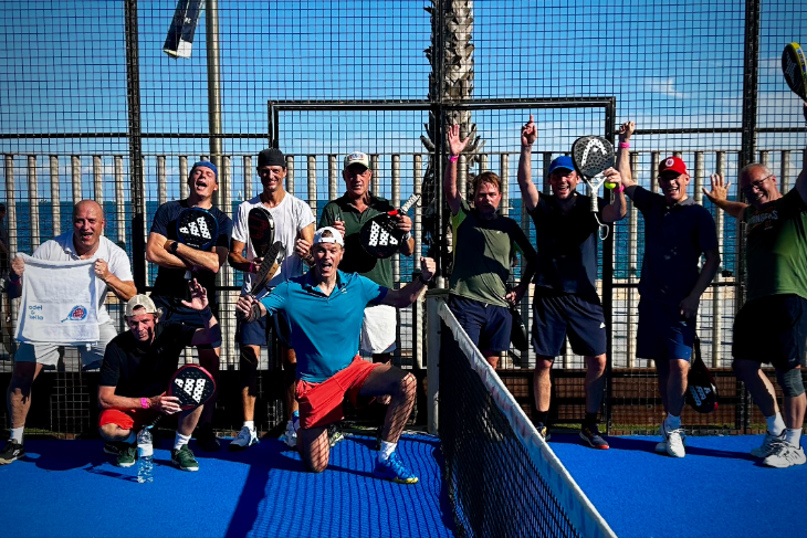 Happy and exhausted Belgian padel players posing with top coach Marc Lisbona after 5 days of intense training at Padel Club Masnou in Barcelona.