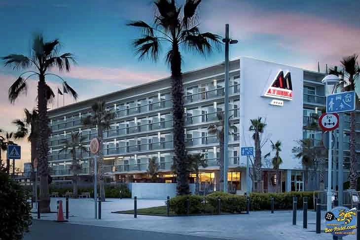 Luxury hotel with nearby padel courts in a scenic destination setting.