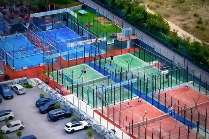 Aerial view of Can Teixidó Pàdel Club with panoramic padel courts and coastal surroundings