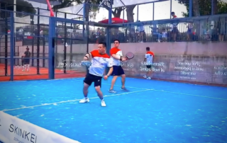 Padel players at Can Teixidó Pàdel Club smiling while trying to cooperate during a fast-paced point