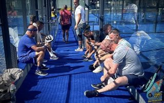 Overview between padel courts at SorliSport, showing the Dutch padel team taking a break during an intensive Bee-Padel training session in Vilassar, Barcelona.