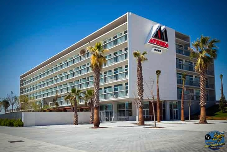 Full side view of the elegant front façade of Hotel Atenea Port Mataró near the beach