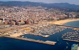 Aerial view of Mataró city showing the historic town centre, harbour, and beautiful Mediterranean waterfront