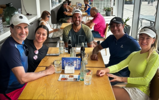 Bee-Padel participants enjoying a relaxed break with Q&A and laughter during intensive training