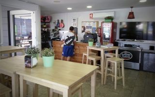 Entrance area of Restaurant Reverse, Padel Shop, and check-in desk at Masnou Ocata Padel Club, Barcelona