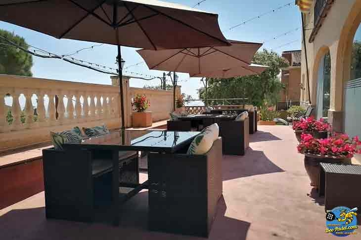 Restaurant terrace at Villa Cal Music B&B with panoramic views over the city below and the Mediterranean Sea
