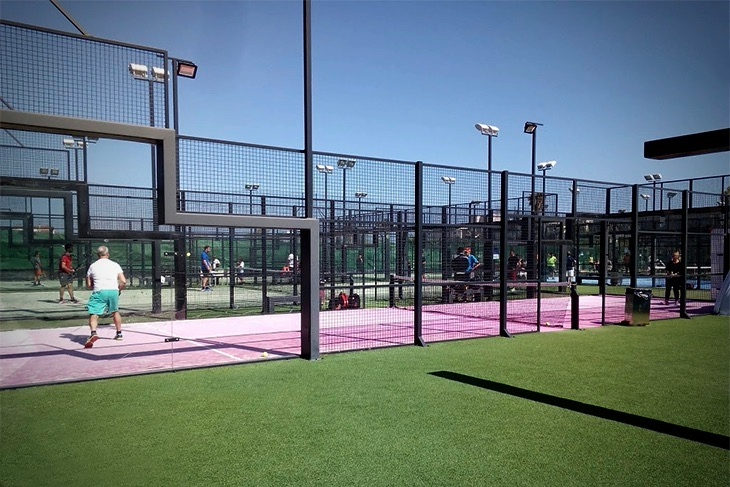 Players enjoying a singles padel match on the dedicated singles court at Masnou Padel Club Ocata in Barcelona, Spain.