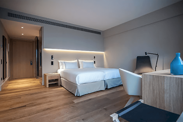 Elegant 4-star hotel room at Sorli Emocions with modern amenities and warm Mediterranean design