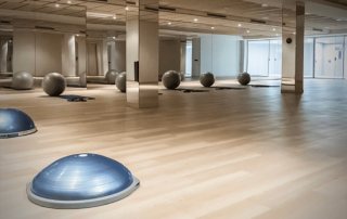 Interior view of SorliSport’s fitness halls set up for group classes including yoga, BodyPump, salsa, bachata, and prenatal sessions.