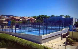View from the hotel rooftop terrace overlooking all six panoramic padel courts at SorliSport in Vilassar, Barcelona.