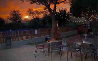 Romantic sunset view over the Mediterranean with Can Teixidó restaurant terrace in the foreground